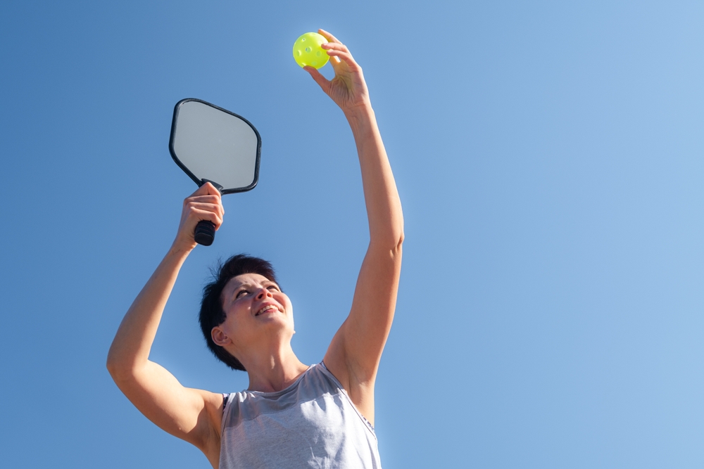 Woman serving pickleball in overland park ks.