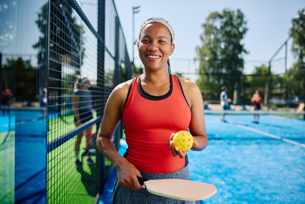 Woman playing pickleball one of many fun things to do in Overland Park.